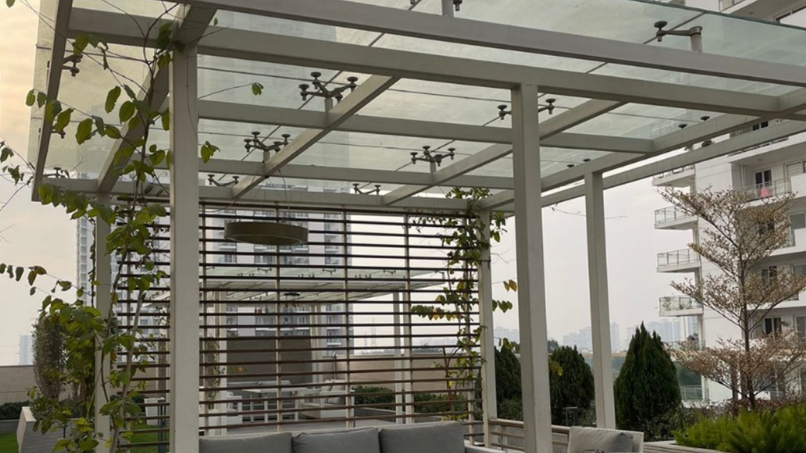Modern home interior enhanced with natural light through glass roof skylight in Faridabad for energy-efficient living.